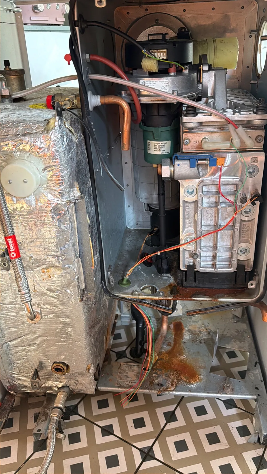 Condemned floor-standing boiler opened up for removal in Solihull