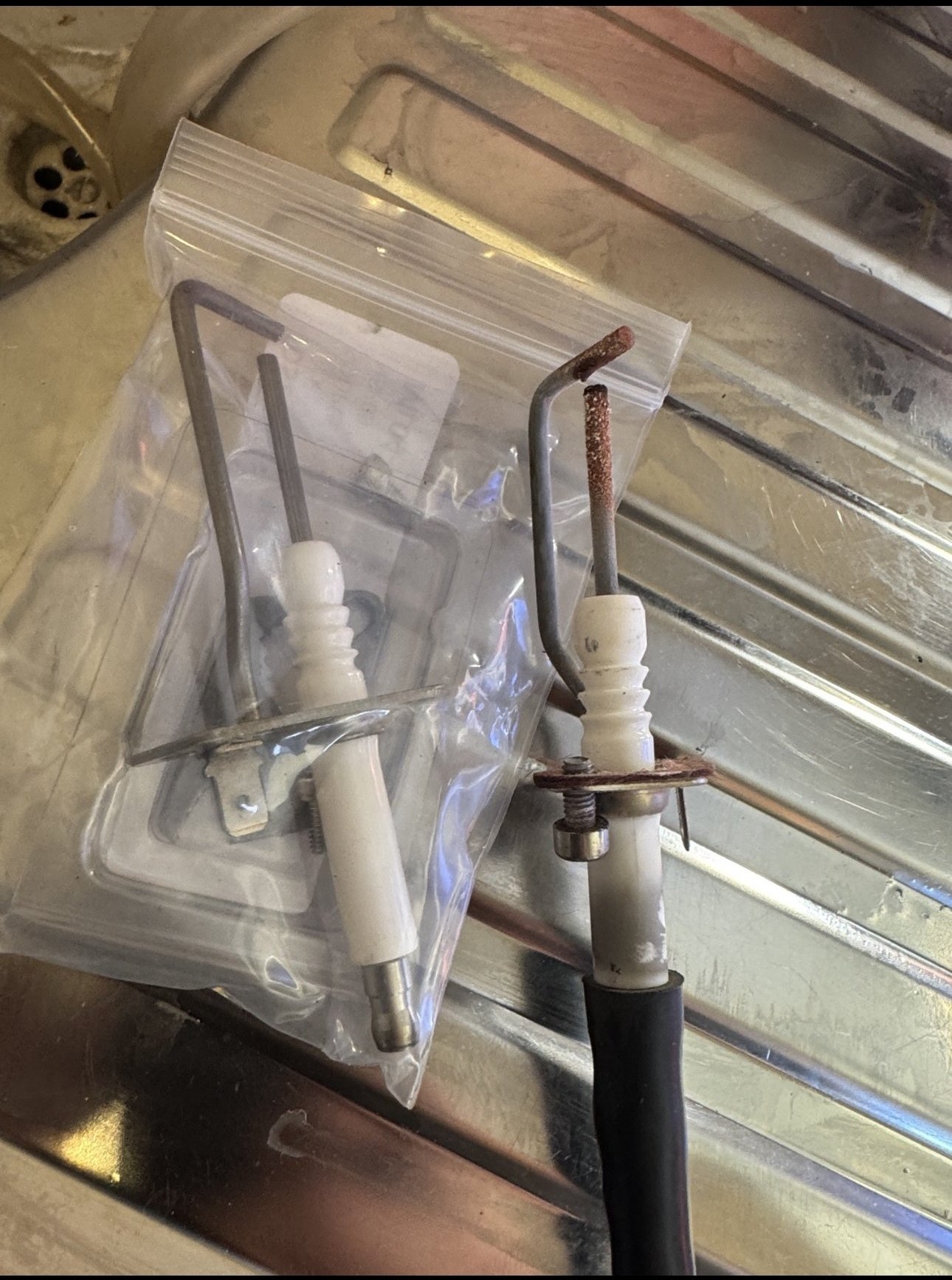 Replacement boiler component being fitted during a repair