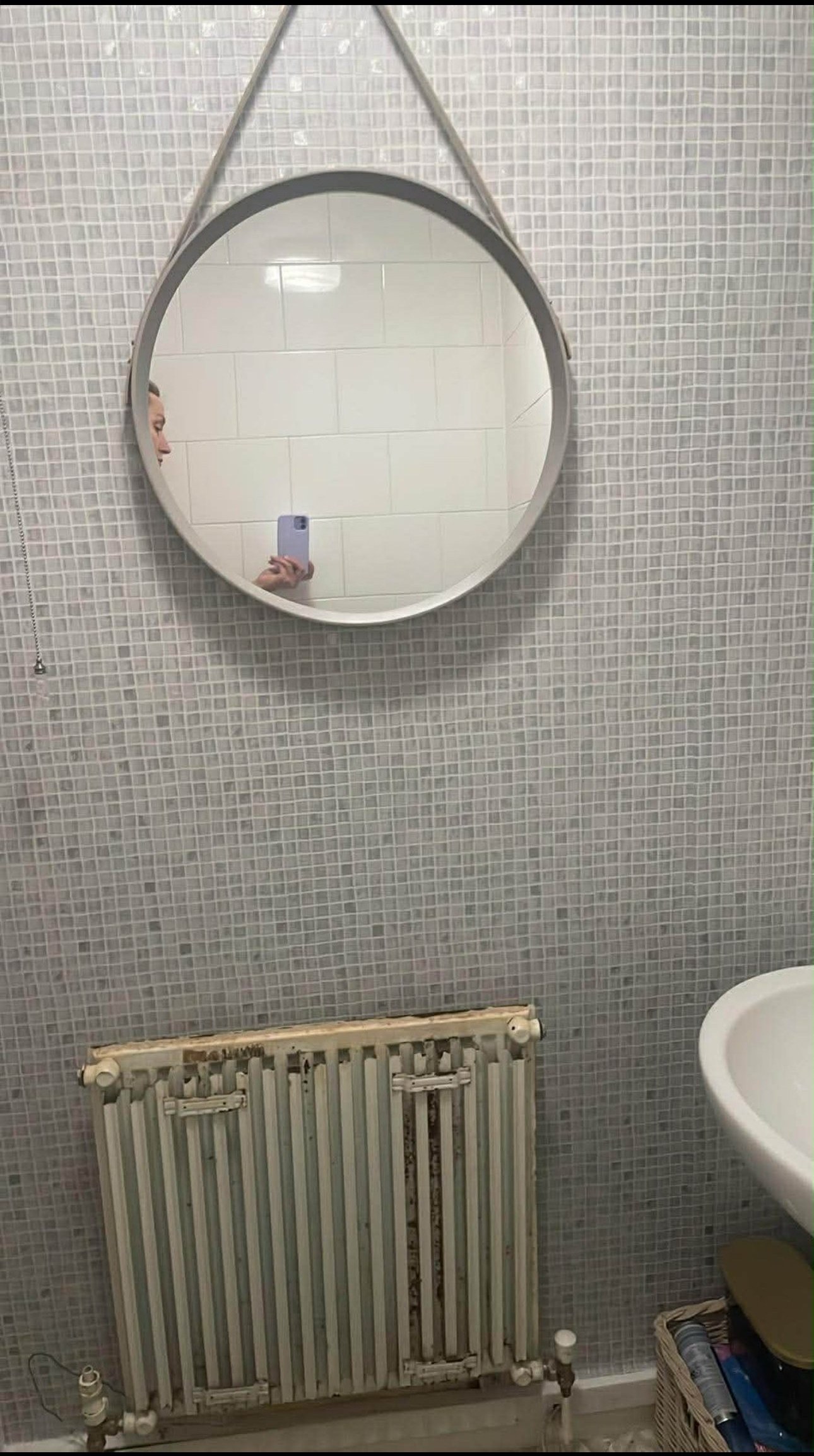 Column designer radiator in a hallway